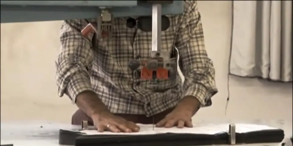 Cutting a fabric stack with an upright knife